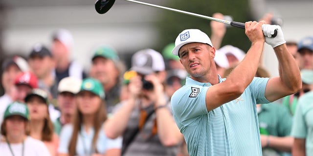 Bryson DeChambeau plays his shot from the first tee during a practice round prior to the Masters Tournament on April 3, 2023.