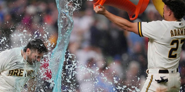 Garrett Mitchell of the Milwaukee Brewers is doused as he celebrates his walk-off home run against the New York Mets at American Family Field on April 5, 2023.