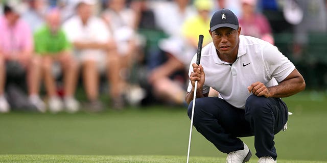 Tiger Woods lines up a putt on the 18th green during the first round of the 2023 Masters Tournament at Augusta National Golf Club on April 6, 2023 in Augusta, Georgia.