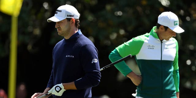 Patrick Cantlay and Viktor Hovland at the first green during the final round of the Masters on April 9, 2023.