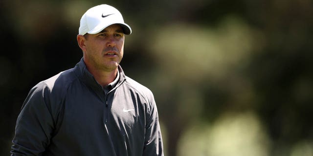 Brooks Koepka walks on the first hole during the final round of the Masters at Augusta National Golf Club on April 9, 2023.
