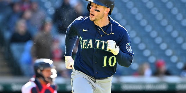 Jarred Kelenic of the Seattle Mariners celebrates after hitting an RBI double against the Guardians at Progressive Field on April 9, 2023, in Cleveland, Ohio.
