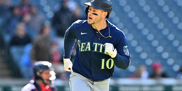 Jarred Kelenic of the Seattle Mariners celebrates after hitting an RBI double against the Guardians at Progressive Field on April 9, 2023, in Cleveland, Ohio.