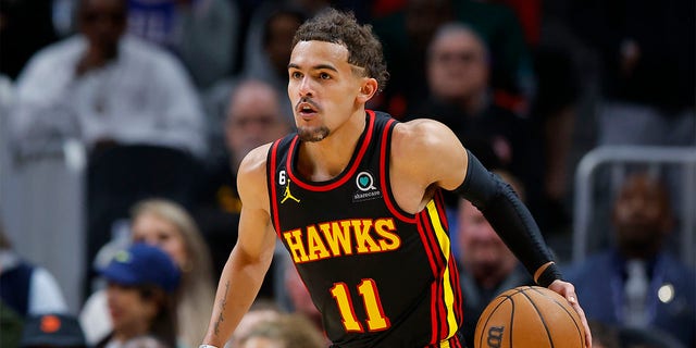 Trae Young of the Hawks drives down the court against the Philadelphia 76ers at State Farm Arena on April 7, 2023 in Atlanta.