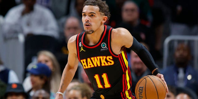 Trae Young of the Hawks drives down the court against the Philadelphia 76ers at State Farm Arena on April 7, 2023, in Atlanta.