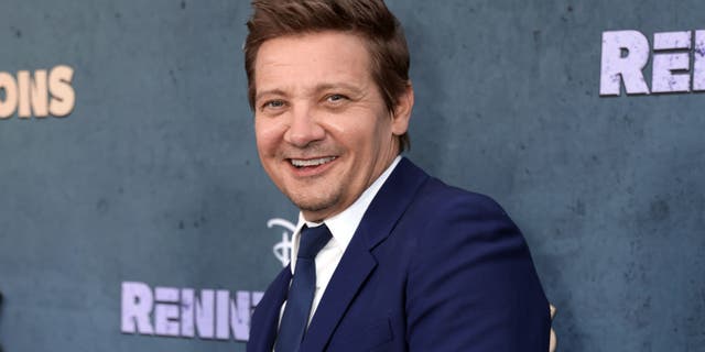 Jeremy Renner smiles at his first red carpet appearance since his accident.