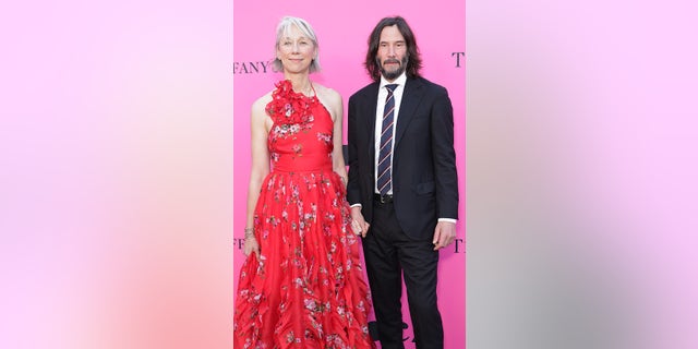 "John Wick" star Keanu Reeves was all smiles as he stepped out hand-in-hand with 49-year-old artist Alexandra Grant in a rare red-carpet appearance.