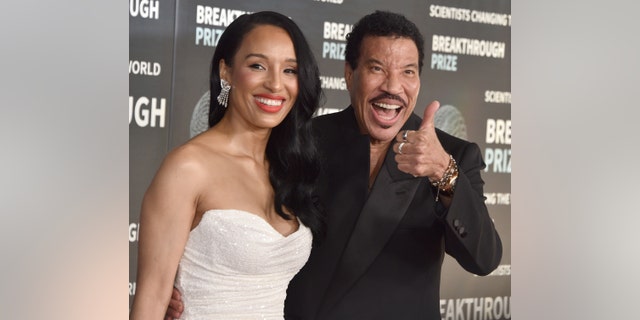 Lionel Richie, seen here with girlfriend Lisa Parigi, said it's a "surprise" and "an honor" to be asked to perform at the coronation concert for King Charles III.