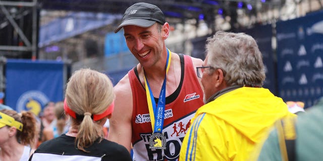 Zdeno Chara crosses the finish line at the Boston marathon