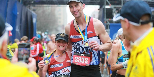 Zdeno Chara crosses the finish line at the Boston marathon