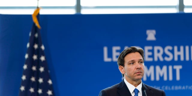 Gov. DeSantis speaking on a stage