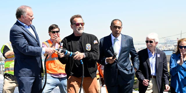 Terry Tamminen, President/CEO of AltaSea and former Governor of California Arnold Schwarzenegger, energize the 4-acre solar rooftop of the AltaSea warehouse at the Port of Los Angeles