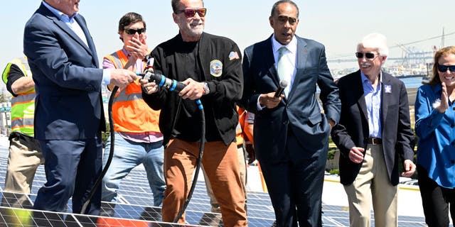 Terry Tamminen, President/CEO of AltaSea and former Governor of California Arnold Schwarzenegger, energize the 4-acre solar rooftop of the AltaSea warehouse at the Port of Los Angeles