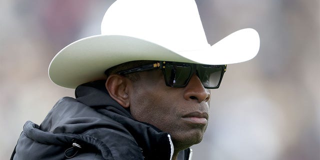 Deion Sanders his Colorado team warm up