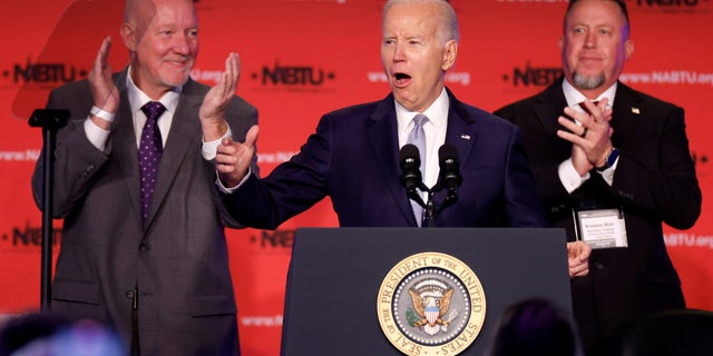 WASHINGTON, DC - APRIL 25: U.S. President Joe Biden (C) is welcomed to the stage by North America's Building Trades Unions President Sean McGarvey (L) and Secretary-Treasurer Brandon Bish during their legislative conference at the Washington Hilton on April 25, 2023 in Washington, DC. Earlier in the day, Biden released a video where he officially announced his re-election campaign. (Photo by Chip Somodevilla/Getty Images)