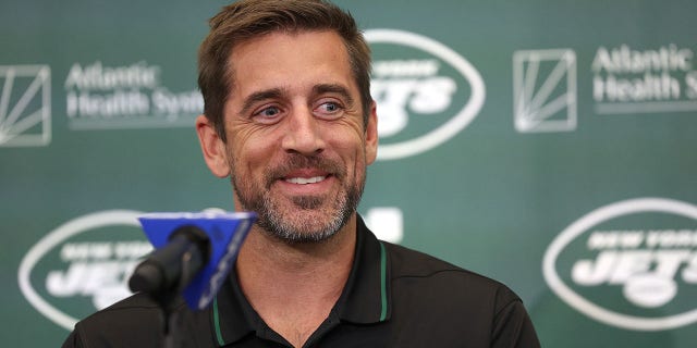 Aaron Rodgers attends an introductory press conference with the Jets