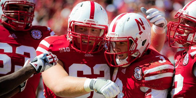 Quarterback Taylor Martinez (3) of the Nebraska Cornhuskers is congratulated by offensive lineman Cole Pensick (62) during a game at Memorial Stadium Sept. 15, 2012, in Lincoln, Neb.