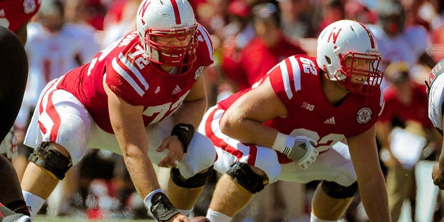 Nebraska offensive linemen Justin Jackson (72) and Cole Pensick (62) before snapping the ball against the Arkansas State Red Wolves at Memorial Stadium Sept. 15, 2012, in Lincoln, Neb.