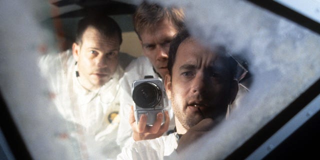 Bill Paxton, Kevin Bacon and Tom Hanks looking out the ship window in a scene from the film "Apollo 13" in 1995. 