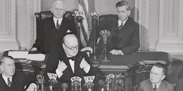 This is an historic moment set by Winston Churchill when he addressed both houses of Congress, members of the Supreme Court, the Cabinet and Diplomatic Corps in 1941. In the rear are Rep. William P. Cole of Maryland; Speaker Pro Tem. of the House; and Vice President Henry A. Wallace.