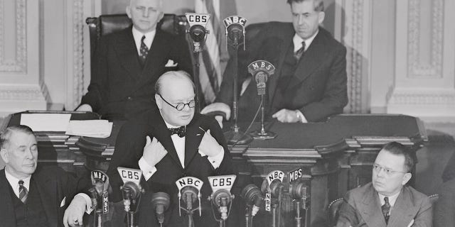 This is an historic moment set by Winston Churchill when he addressed both houses of Congress, members of the Supreme Court, the Cabinet and Diplomatic Corps in 1941. In the rear are Rep. William P. Cole of Maryland; Speaker Pro Tem. of the House; and Vice President Henry A. Wallace.