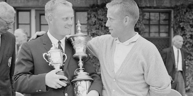 Jack Nicklaus, left, of Columbus, Ohio, won the U.S. National Amateur Championship at Pebble Beach, California, in 1961; he's congratulated by rurnner-up H. Dudley Wysong, McKinney, Texas. Nicklaus defeated Wysong, 8 up and 6 to go. Nicklaus also won the amateur title in 1959. 