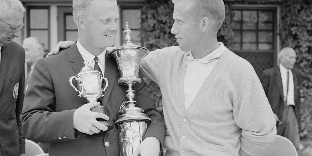 Jack Nicklaus, left, of Columbus, Ohio, won the U.S. National Amateur Championship at Pebble Beach, California, in 1961; he's congratulated by rurnner-up H. Dudley Wysong, McKinney, Texas. Nicklaus defeated Wysong, 8 up and 6 to go. Nicklaus also won the amateur title in 1959. 