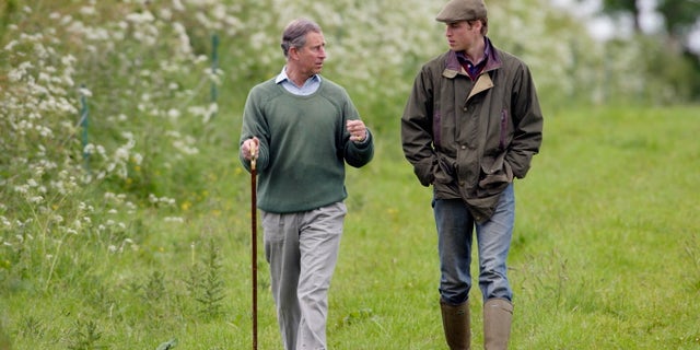 Prince William walking with Prince Charles