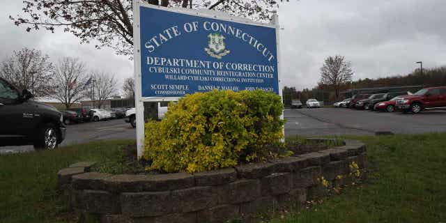 A sign stands in front of Cybulski Rehabilitation Center, which includes the military Veterans Unit on May 3, 2016, in Enfield, Connecticut. The Veterans Unit of the facility houses some 110 prisoners. A rise in the numbers of prison sentenced reductions for inmates, including convicted killers, has sparked debated in Connecticut.