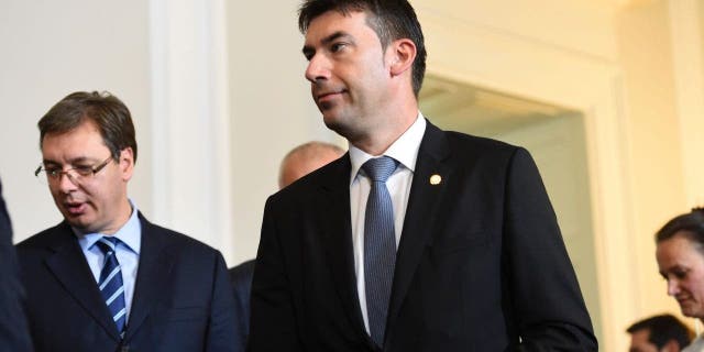 Romania's Foreign Minister Dragos Tudorache walks after a meeting on the Balkan migrant route into the EU in Vienna on Sept. 24, 2016.