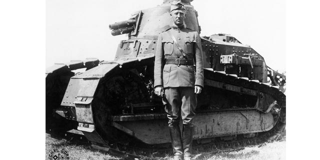 George S. Patton Jr. poses with a tank from his tank corps during a command as a lieutenant colonel in France during World War I.