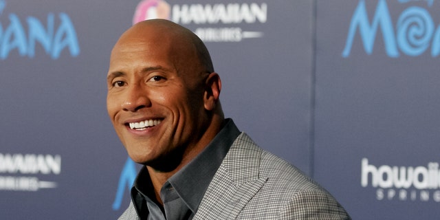 Dwayne Johnson smiles at the Hollywood premiere of "Moana."