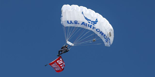 Paratroopers descend prior to the MLB opening day baseball game between the Texas Rangers and Cleveland Indians on April 3, 2017 at Globe Life Park in Arlington, Texas.