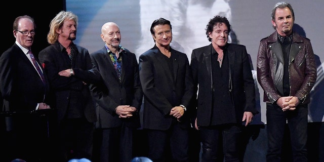 Aynsley Dunbar and the rest of Journey at the Hall of Fame ceremony