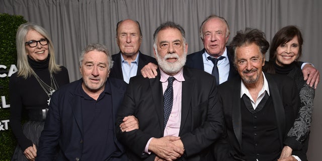 Diane Keaton, Robert DeNiro, Robert Duvall, Francis Ford Coppola, James Caan, Al Pacino and Talia Shire pose for a portrait at "The Godfather"