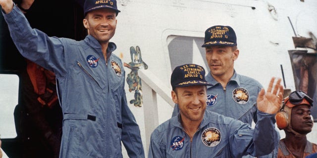 The safe return of the Apollo 13 astronauts after their lunar landing mission encountered technical difficulties, April 17, 1970. From left to right, Lunar Module pilot Fred W. Haise, Mission Commander James A. Lovell (front) and Command Module pilot John L. Swigert (1931-1982). 