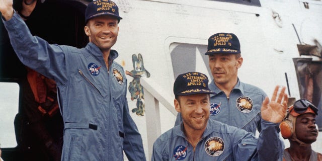 The safe return of the Apollo 13 astronauts after their lunar landing mission encountered technical difficulties, April 17, 1970. From left to right, Lunar Module pilot Fred W. Haise, Mission Commander James A. Lovell (front) and Command Module pilot John L. Swigert (1931-1982).