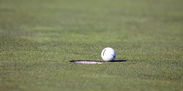 A golf ball does not reach the hole.