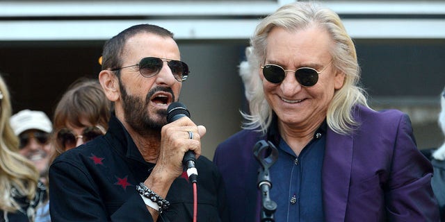Ringo Starr, left, of The Beatles and Joe Walsh of the Eagles celebrate Starr's 77th birthday at Capitol Records Tower on July 7, 2017, in Los Angeles, California. Starr recorded a remake of 1955 landmark hit "(We're Gonna) Rock Around the Clock" in 2021, featuring Walsh on guitar.