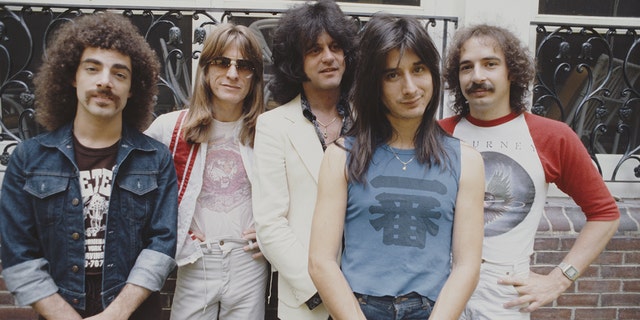 Journey posing for a photo in New York