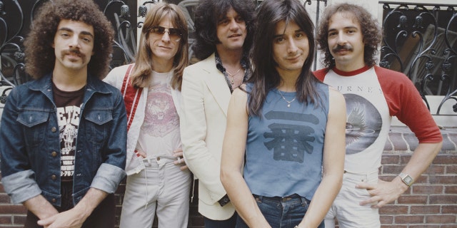 Journey posing for a photo in New York