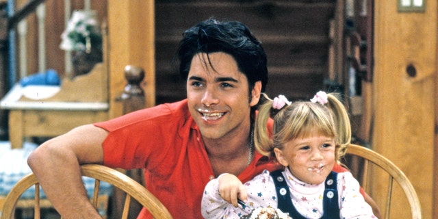 John Stamos Olsen twin on Full House set