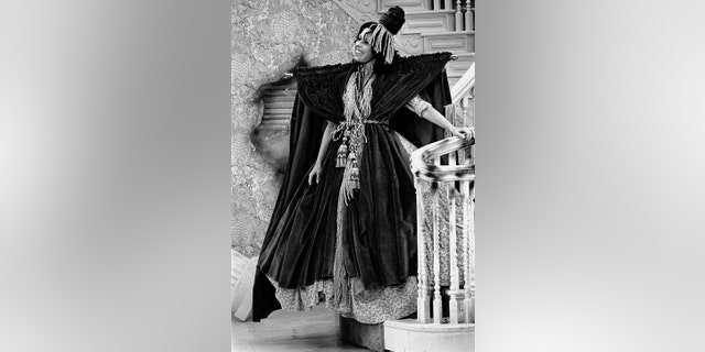 Carol Burnette in a dress made out of curtain drapes