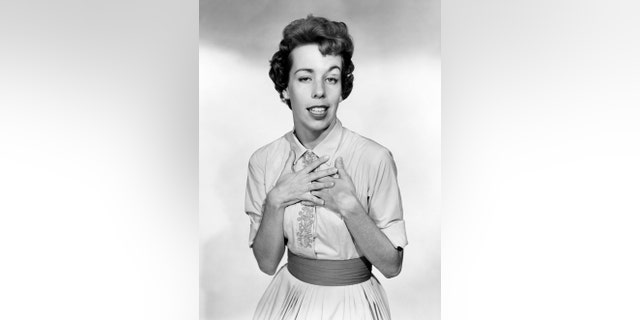 A black and white photo of Carol Burnett making a funny face