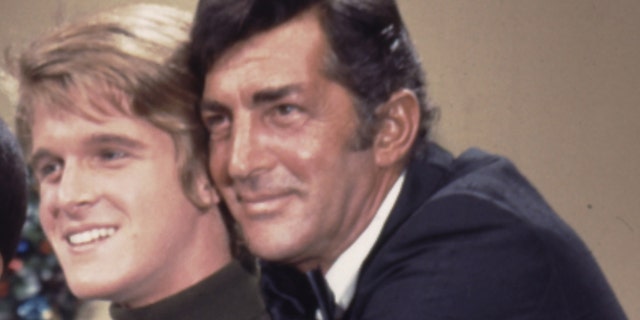 A close-up of Dean Martin embracing his son
