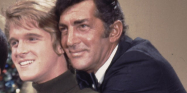 A close-up of Dean Martin embracing his son