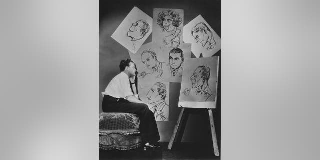 James Cagney looking at drawing cards