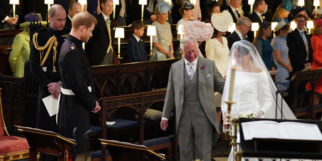 King Charles walking Meghan Markle down the aisle on her wedding day