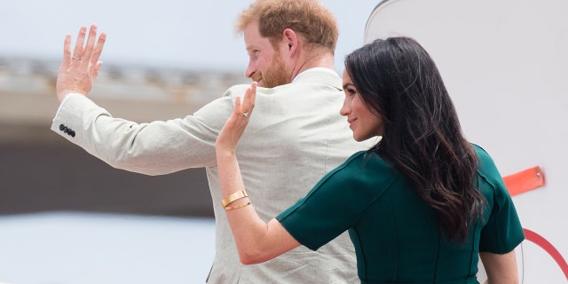 Meghan Markle and Prince Harry wave