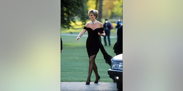 Princess Diana walking in her black revenge dress